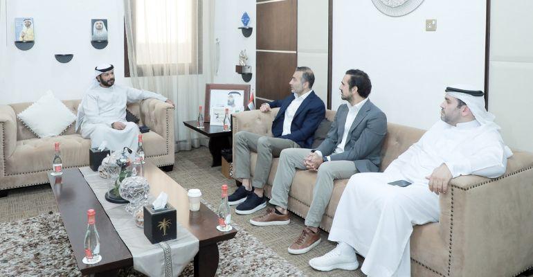 Members of Dubai Land Department and the Stake real estate investmnt platform discussing their new partnership as part of the REES initative.jpg